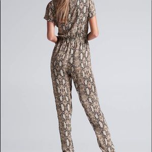 Long sleeve python  jumpsuit with  jogger type hem.  .  Front zip